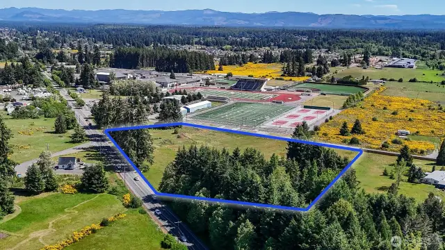 All amenities at your fingertips: minutes from downtown Yelm and a short drive to Lacey and JBLM. Blue boundary lines are approximate. Buyer to verify to their own satisfaction.