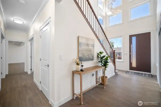 Downstairs entry with storage under the stairs.