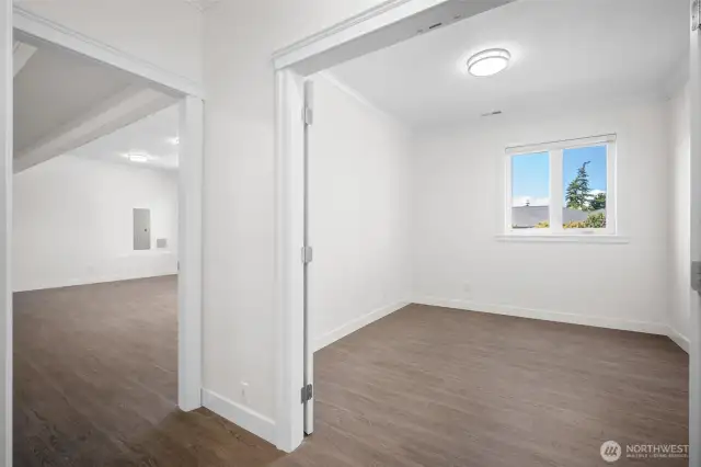 4th bedroom on the right, expansive family/entertainment room on the left.