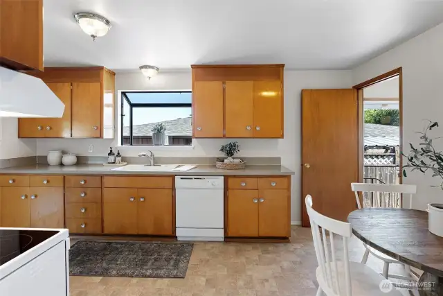 Kitchen with access to side door and basement