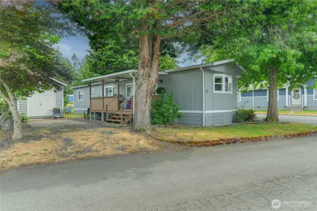 Rear entry through slider.  Cozy covered porch with view of the Lake.