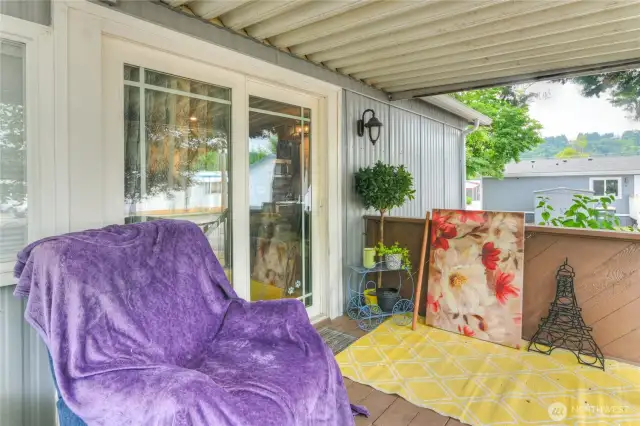 large covered porch with partial lake view.