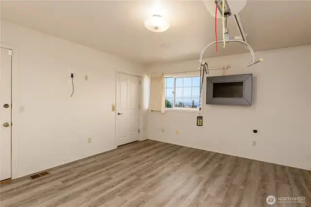 Primary bedroom with elevator and backyard access