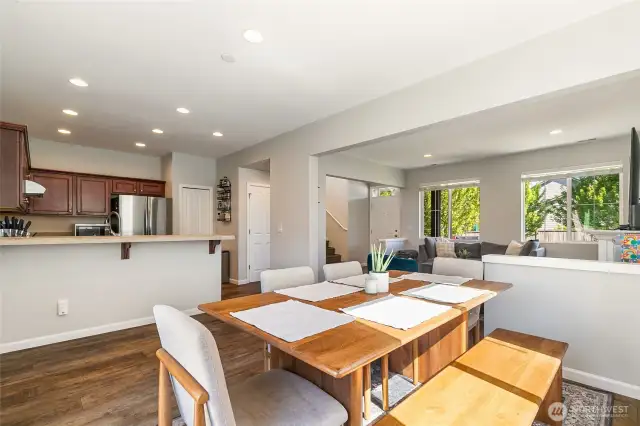 Spacious dining area between kitchen and living room