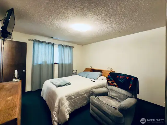 Spacious secluded primary bedroom with bathroom ensuite.