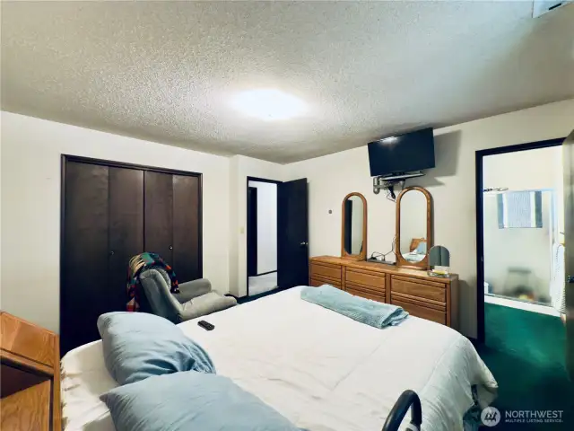 Primary bedroom with 3/4 bathroom, built in storage, great floor plan for easy living.