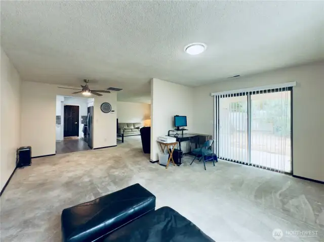 Slider to fully fenced back yard with a patio, mature plantings, and a clean slate to create your outdoor sanctuary.