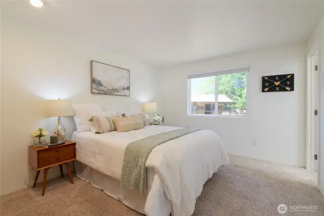 The spacious primary suite offers a peaceful retreat, complete with a full bath with skylight that fills the space with natural light. Fresh interior paint throughout the home!