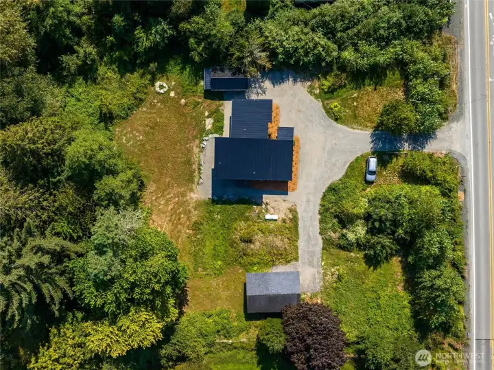 Acre property with garage and shop.