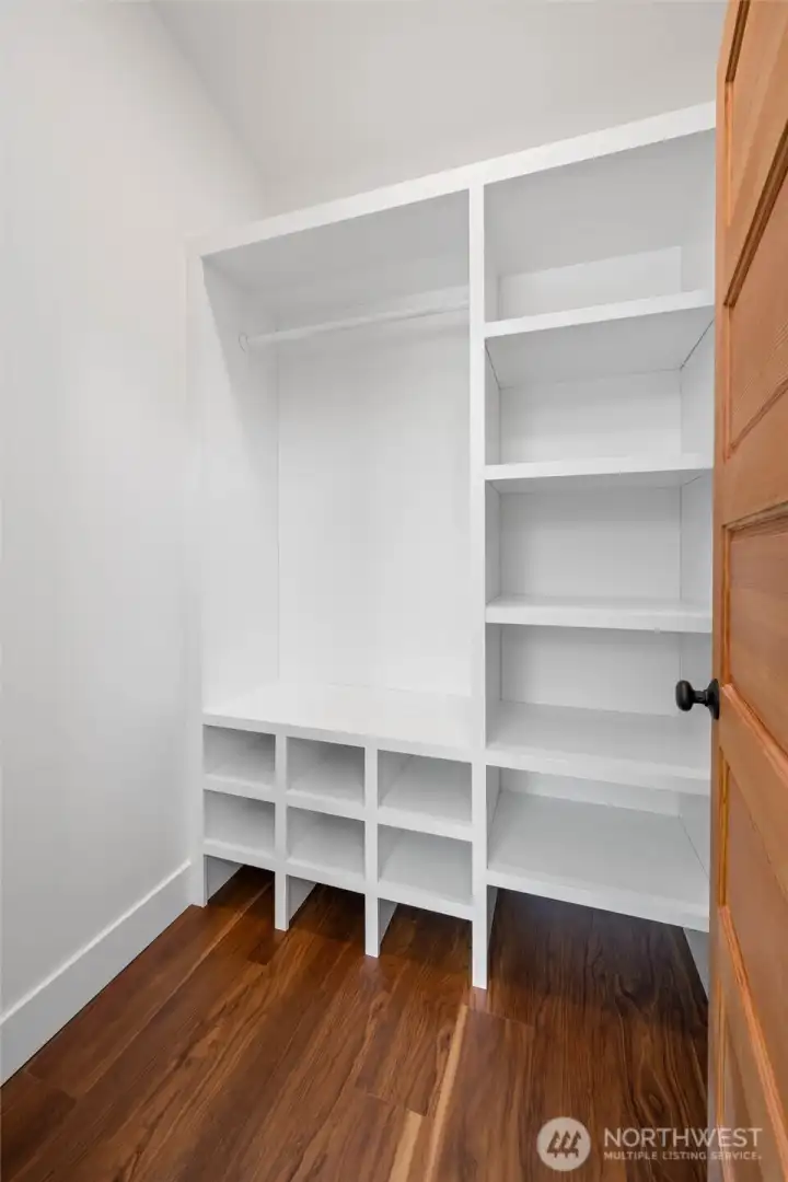 Custom cabinetry in the primary bedroom closet