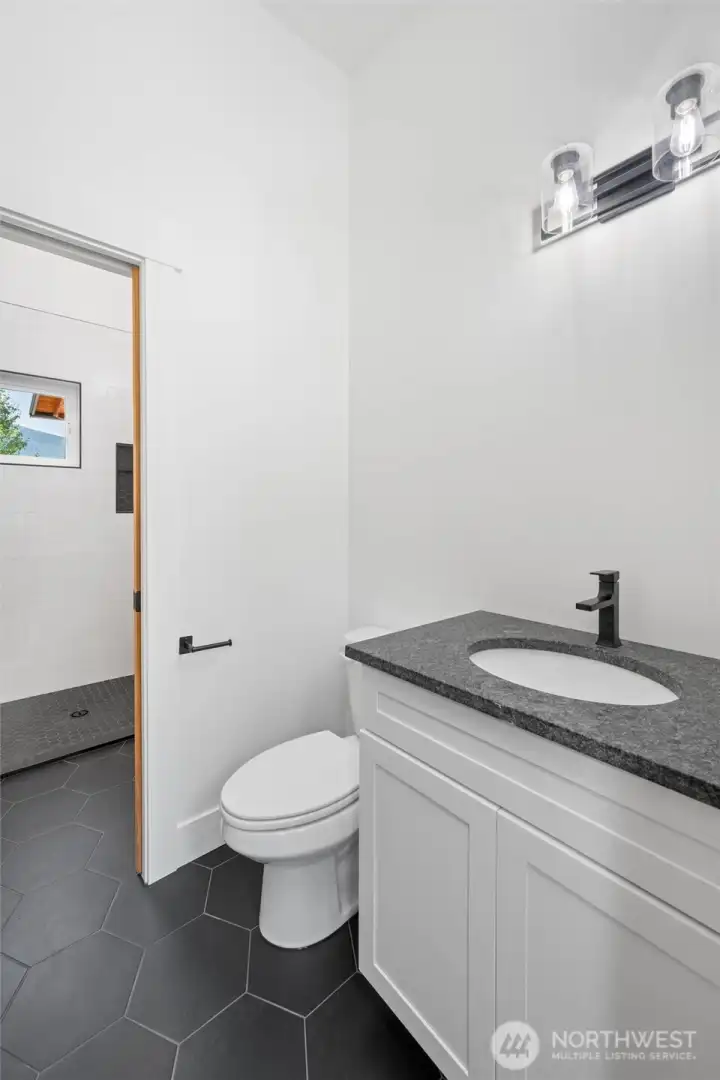 Downstairs bathroom with in-floor heating.