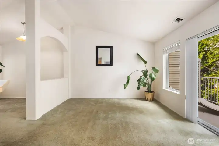 Living & Dining Flow: Vaulted ceilings and abundant natural light highlight the seamless connection between living and dining areas. The open pass-through design enhances flow and function, creating a bright, welcoming space for everyday living and entertaining.