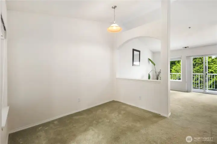 Dining Area: Defined dining space with vaulted ceilings and natural light, open to the living room and kitchen for effortless entertaining