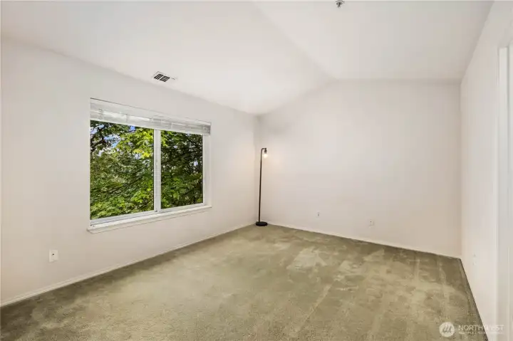 Primary Bedroom: Spacious primary suite with vaulted ceiling, walk-in closet, and ensuite bath. Peaceful retreat with greenbelt outlooks.