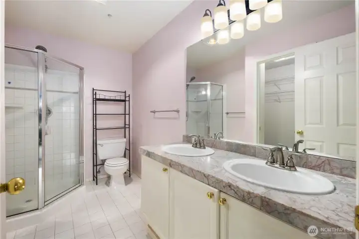 Primary Bath: Ensuite bath with dual vanity, walk-in shower, and plenty of storage, designed for everyday comfort and function.