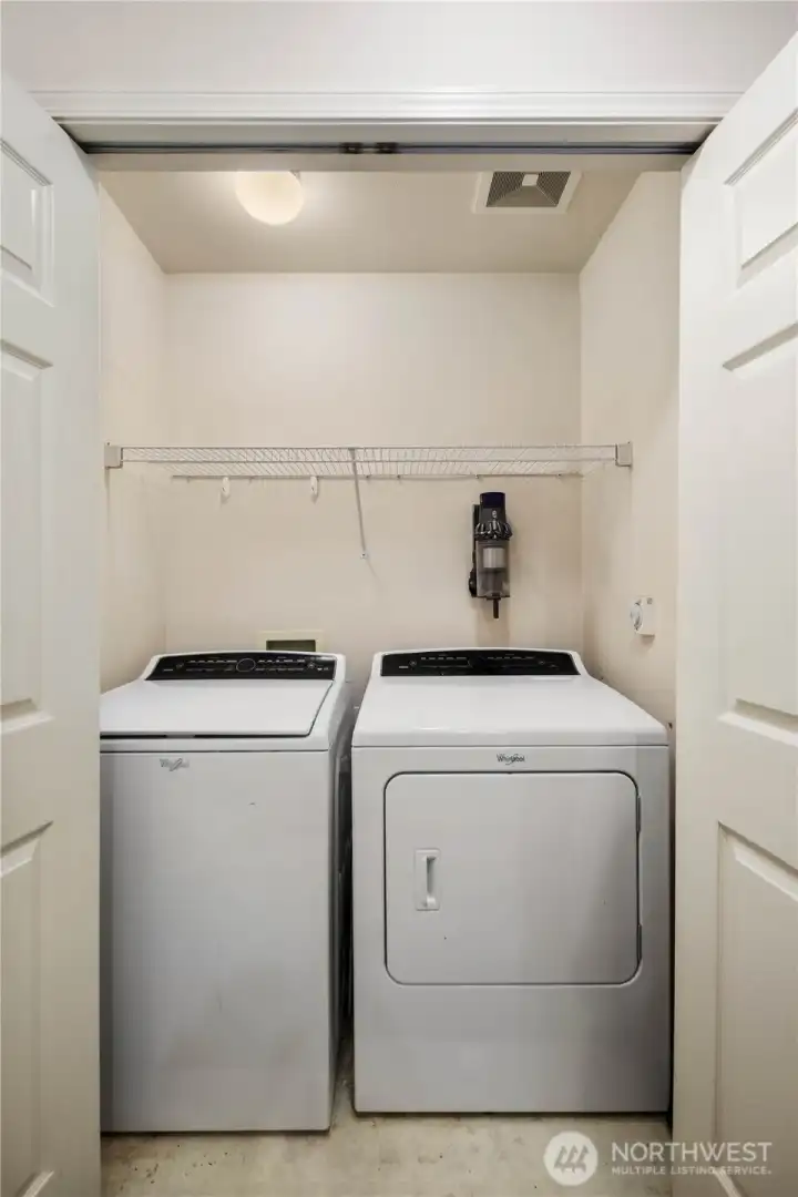 Laundry: In-unit laundry with washer and dryer included, plus storage shelf for organization.