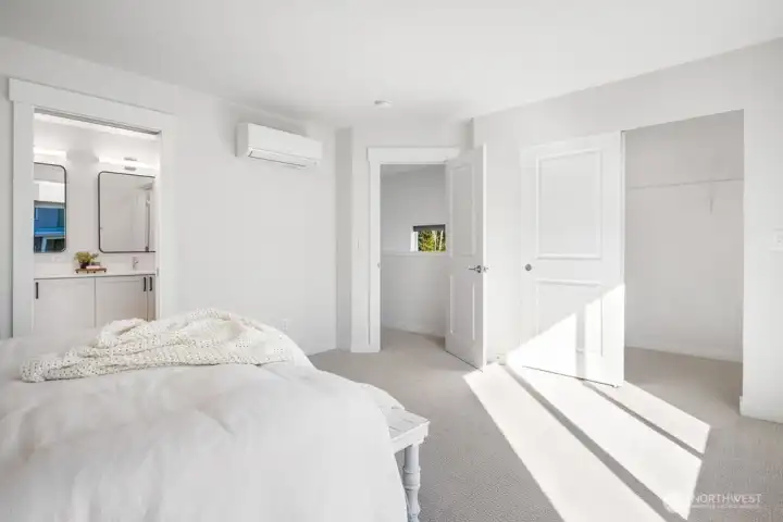Primary bedroom view to walk-in closet and primary bath.