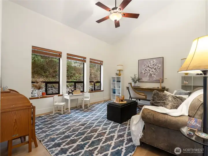 The room at the left of the entrance can be a formal living room or an office; you choose.