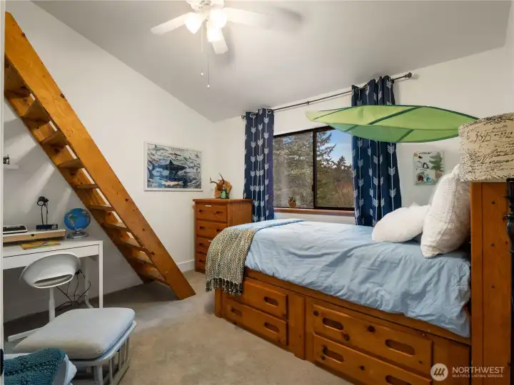 The first bedroom on the top floor has its own sleeping loft.