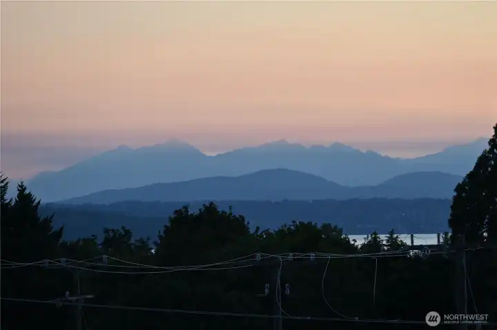 An Elton Bennett-like sunset over the Olympic Mountains.  (Bennett was a local artist that made silkscreen paintings that looked like this sunset.)