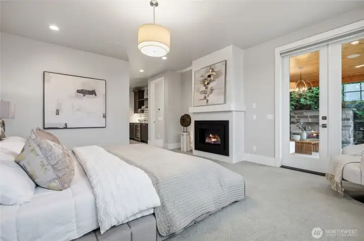 Primary with its own indoor fireplace as well as a private covered terrace.