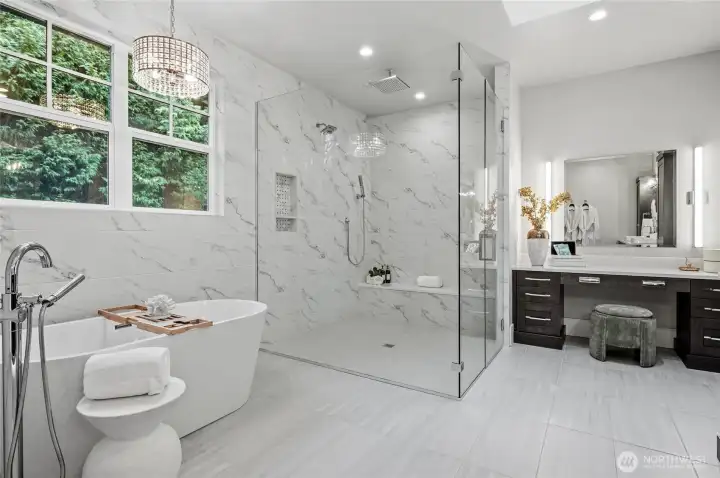 Heated floors, oversize shower with multiple shower heads, and large soaking tub.