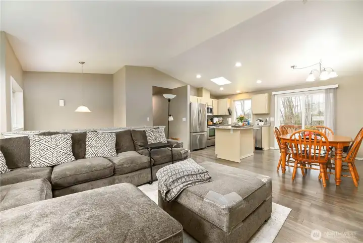 Large main living space, vaulted ceilings and skylight.
