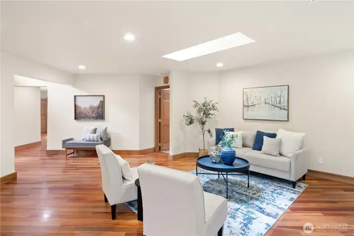 Large living room w/ cherry floors.