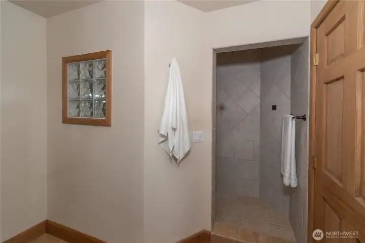 Primary bath w/ large tiled shower.