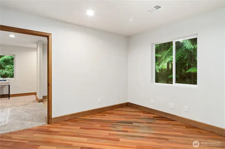 Office w/ cherry hardwood easily flows to additional living area or back to the hallway to the second bedroom.