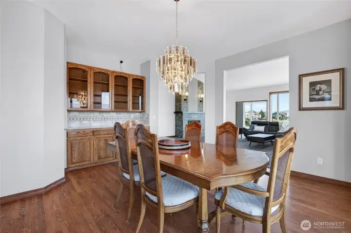 Dining room with built in cabinets and hardwood floors.