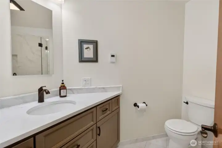 Main level bathroom with heated floors.