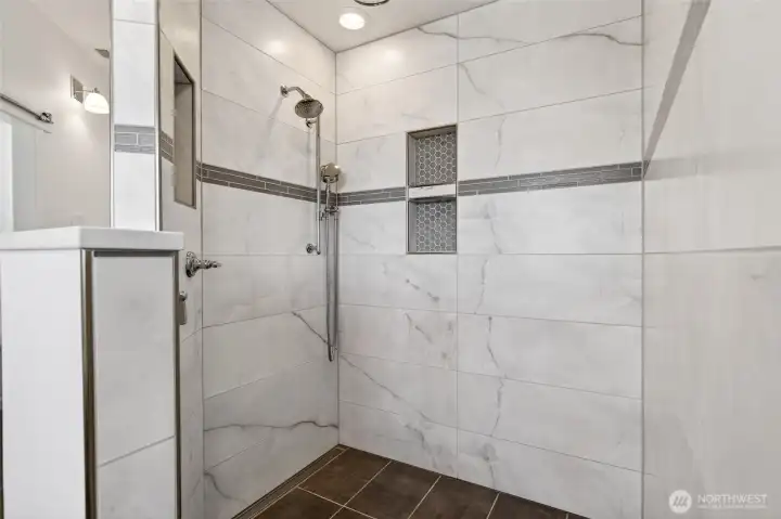 Primary walk-in tile shower.