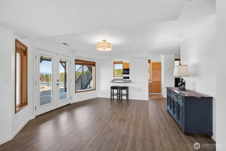 Lower level dining area with French doors to the pool area.