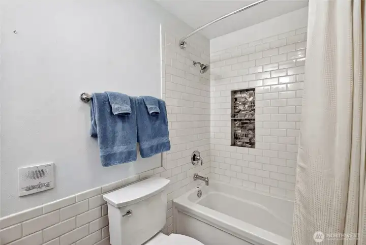 Lower level bathroom with tile shower.