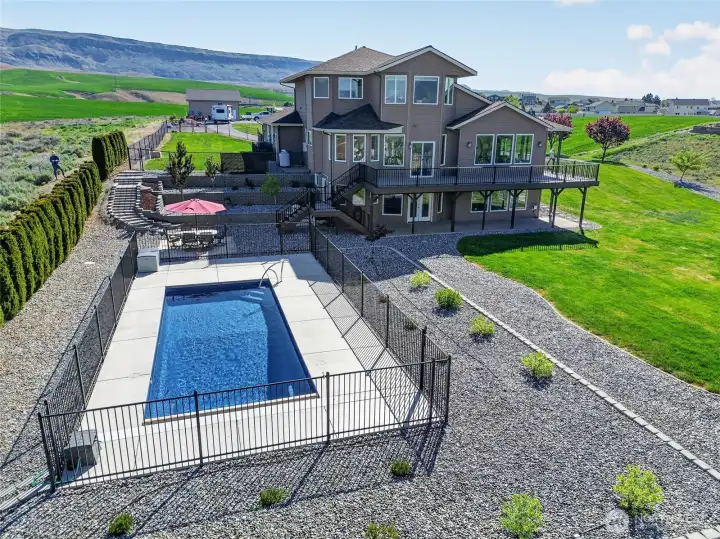 Pool, wraparound deck and patio.