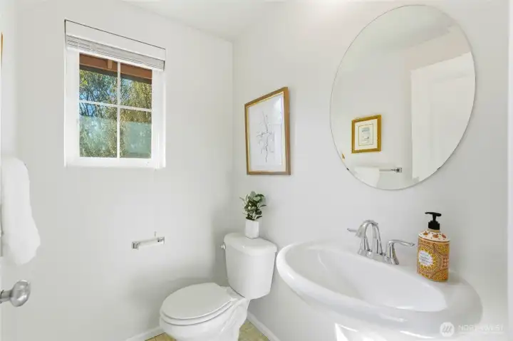 Half bathroom off of the kitchen & dining spaces.