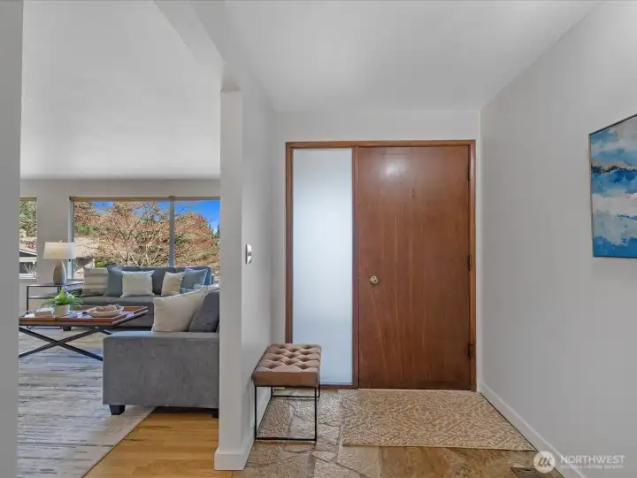 Wide, light entry with flagstone flooring.