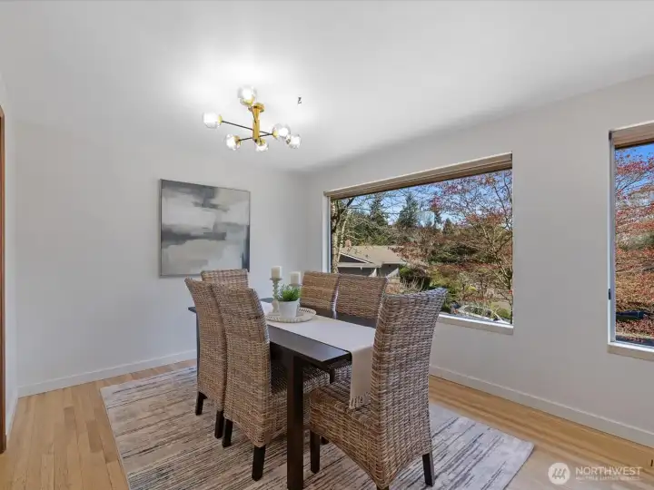 The holiday sized dining room features large view windows.