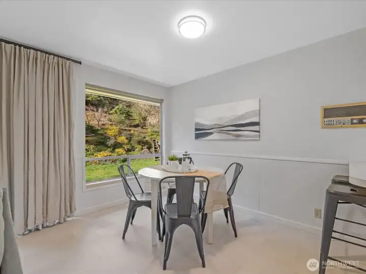 Big windows provide a view of the lovely, private backyard.