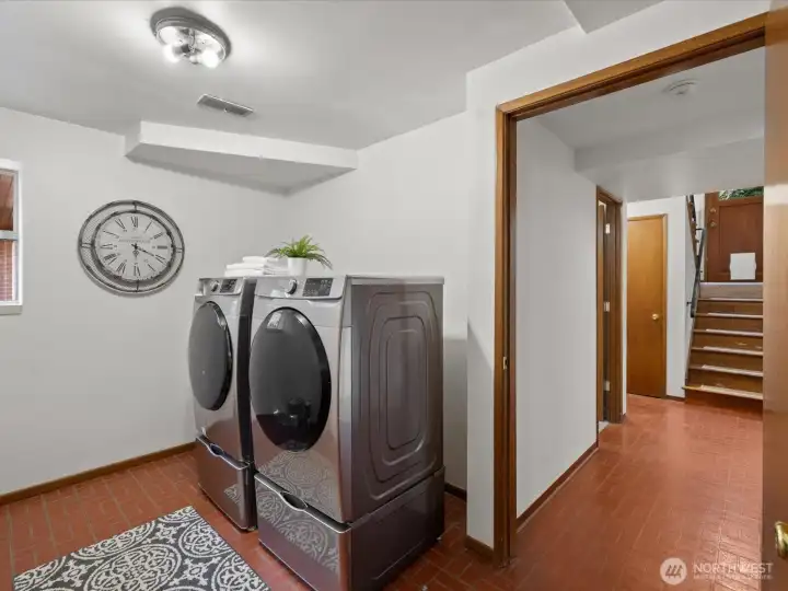 Large laundry room with additional storage space.
