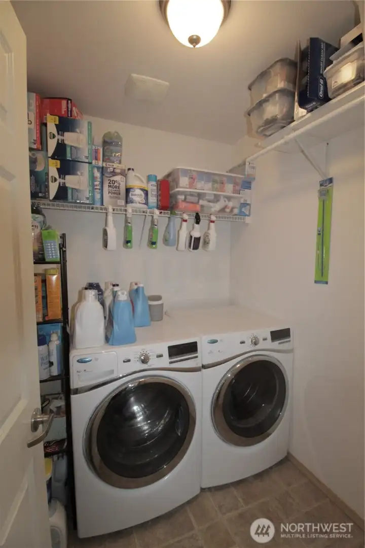 Upstairs laundry with storage