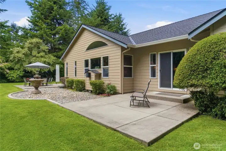 Large patio and sprinklers to keep the lawn green