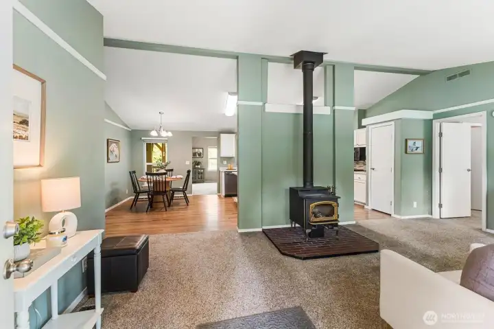 The living room is just off the entry and has vaulted ceilings. There is a freestanding Lopi wood-burning stove for those cold winter nights.