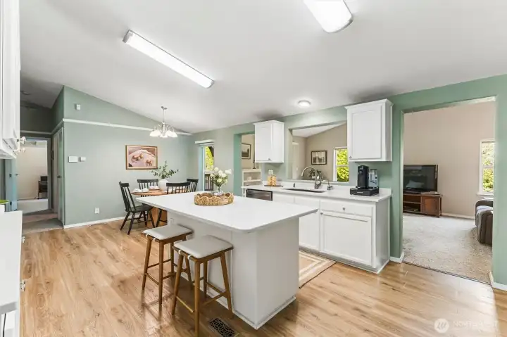 There is an abundance of cabinet and counter space, and the island also has electrical outlets.