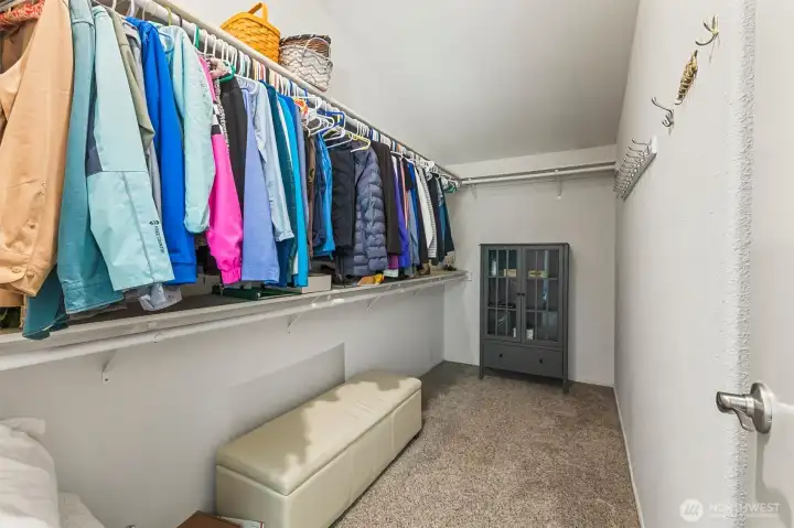 A generous walk-in closet makes every morning feel effortless.