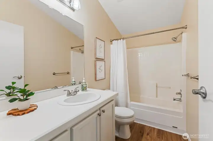 The second bathroom is light and bright.