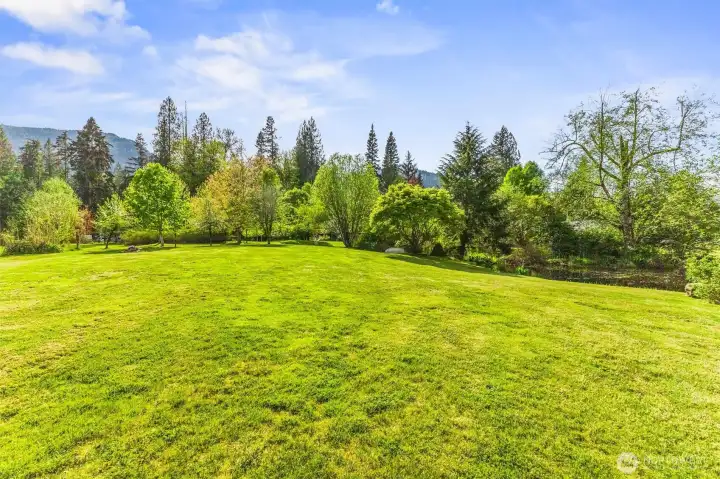 This property is a testament to time and care, featuring over 200 varieties of shrubs, trees and plants, all thoughtfully selected and nurtured by the owner for more than two decades.