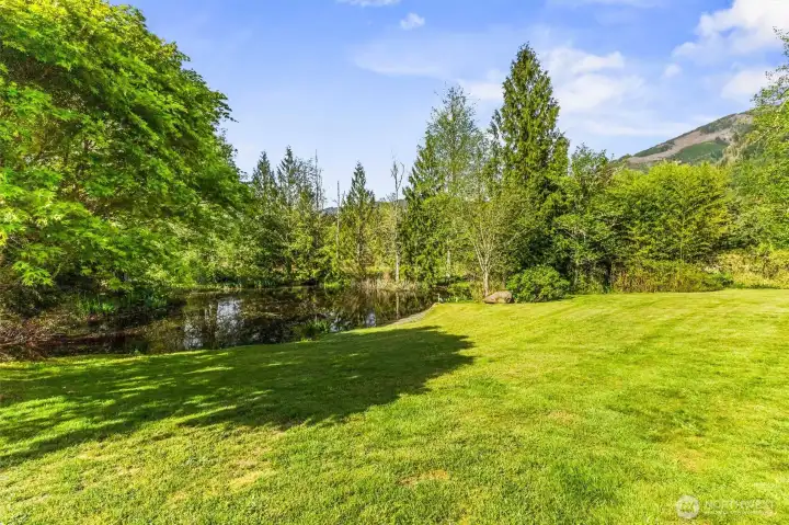 The expansive pond on the property is a vibrant feature, where the owners have spotted bluegill, trout, catfish and perch. It's not only a peaceful place to relax and take in the view, but also is a spot where you can have fun feeding the fish.