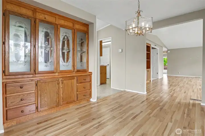 Formal Dining room has laminate floors, built in hutch and overlooks the community greenbelt.